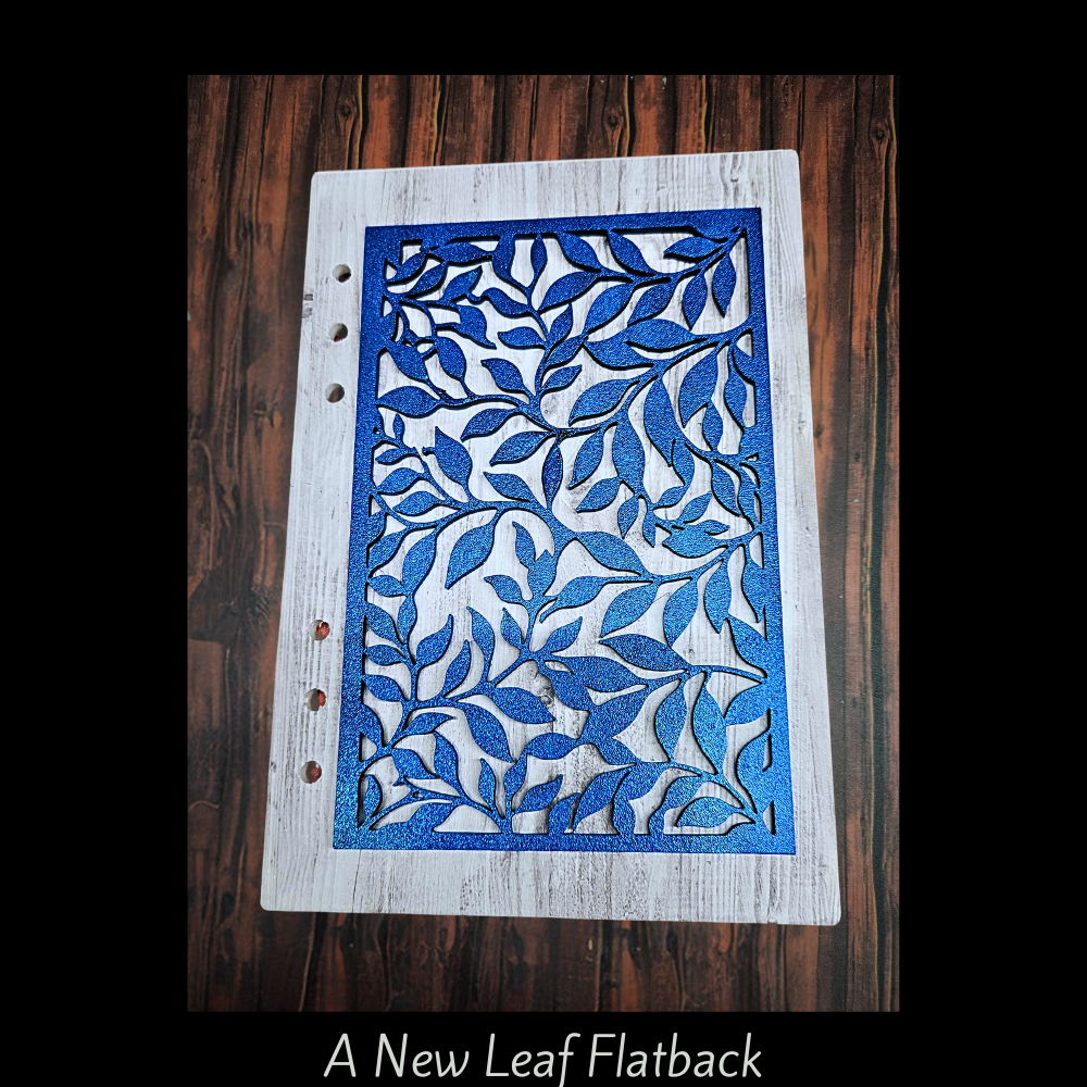 Shown on a decorated A7 Notebook cover blank and colored with blue mica on it.